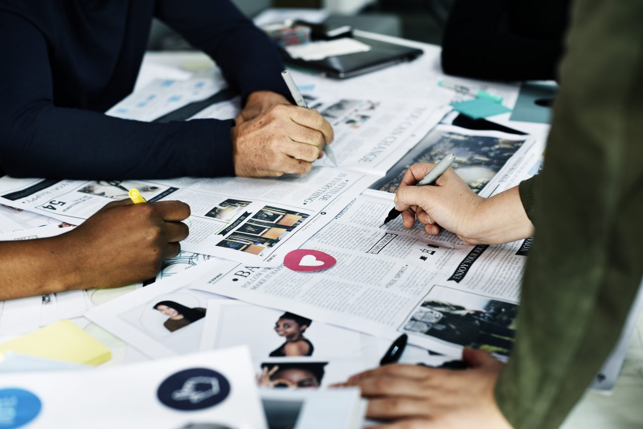 Group of diverse people brainstorming together